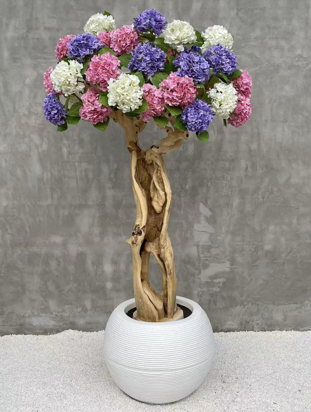 Artificial flowering tree with colorful rounded flower clusters