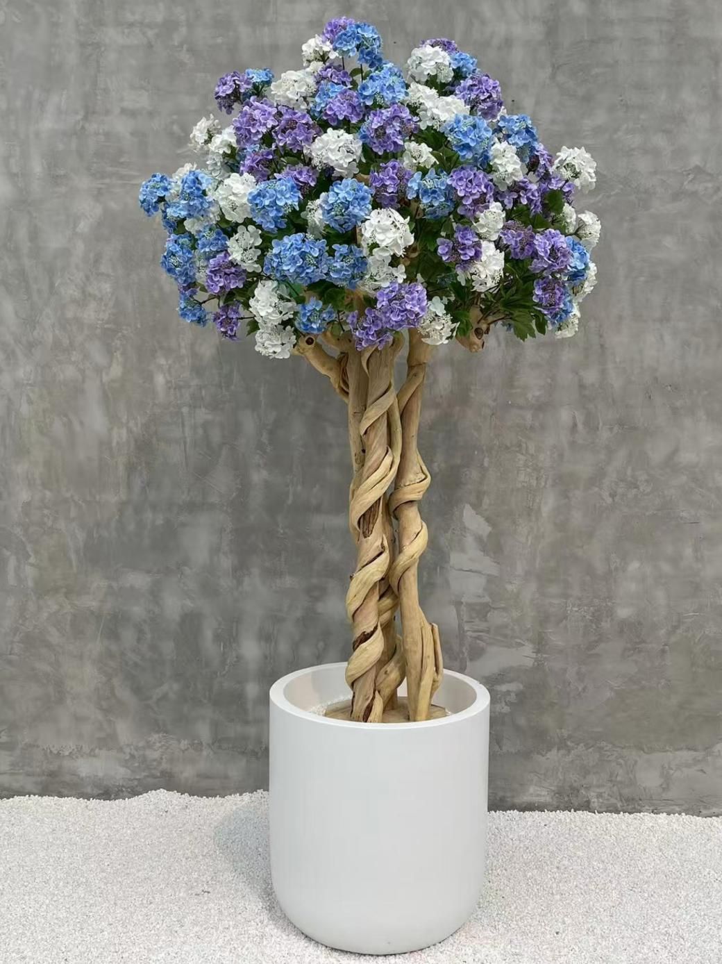 Artificial flowering tree with colorful rounded flower clusters