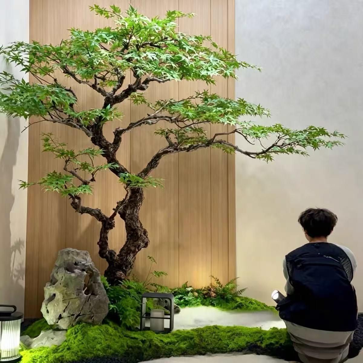 Artificial green foliage tree in an interior display